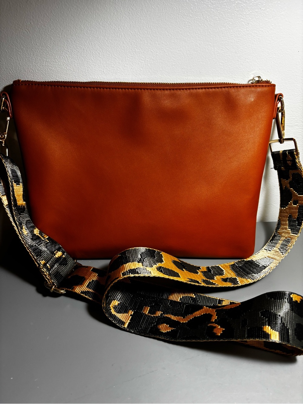 Adorable and pristine Women’s Tan Crossbody Bag with Leopard Accent Strap